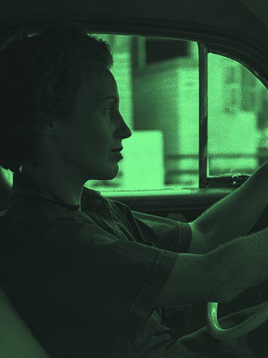 Woman driving a taxi
