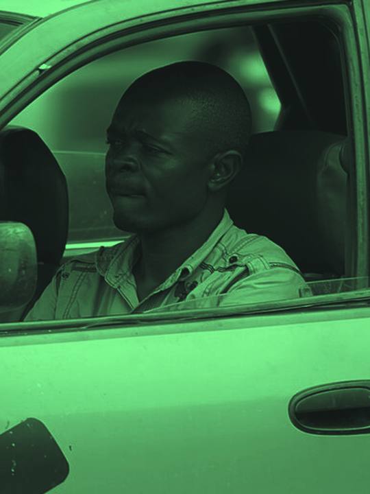 Taxi driver at the wheel